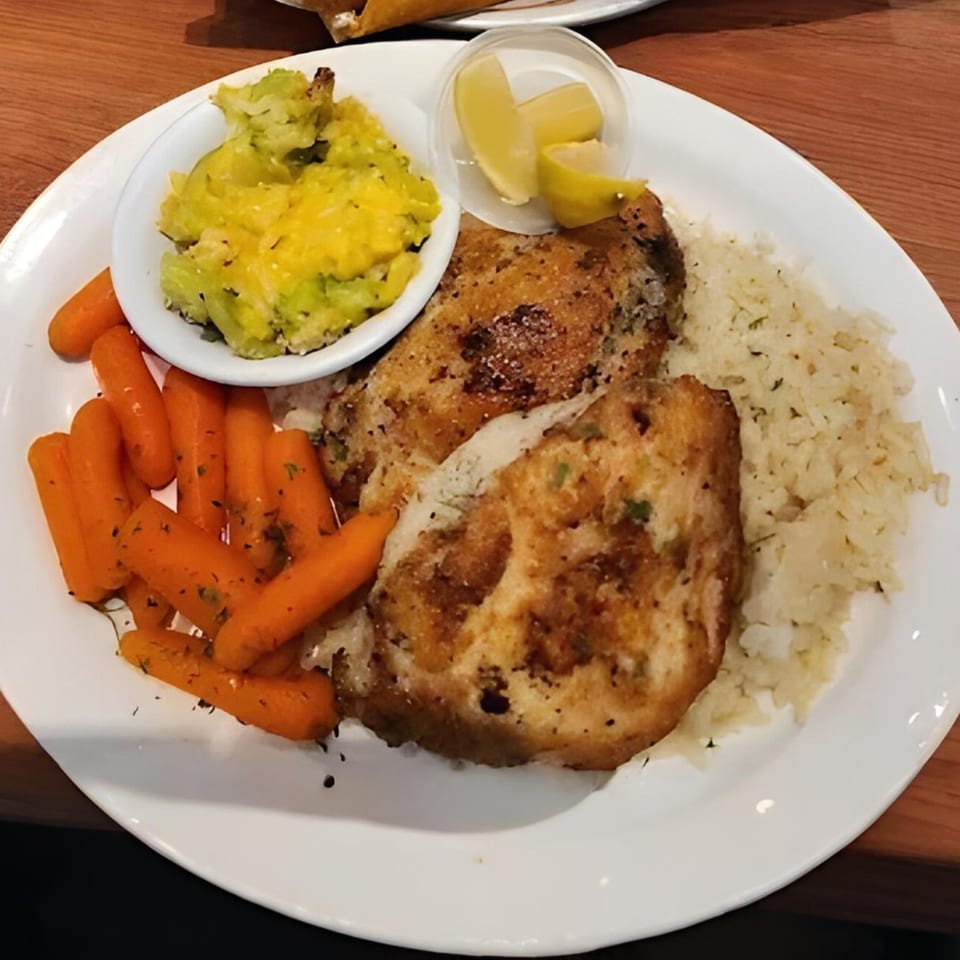 Kings Roadhouse Bar & Grill's American dish with grilled chicken, rice, carrots, and mashed potatoes.